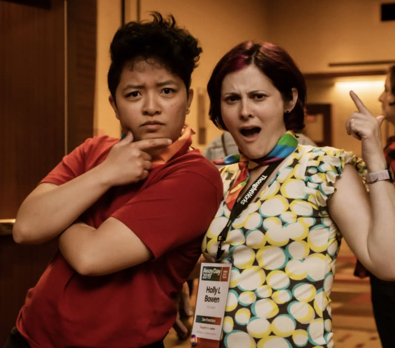 Holly and Rosalie striking poses at a convention