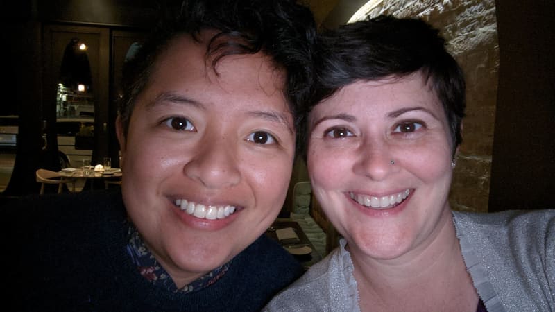 Holly and Rosalie in a dim restaurant