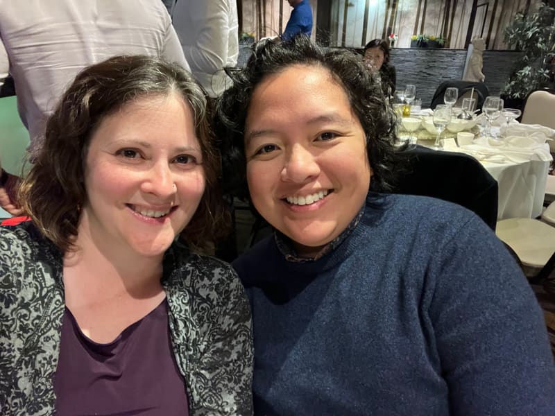 Holly and Rosalie at a wedding reception table